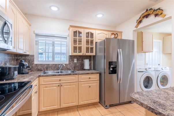 Interior, Kitchen, Recessed Lighting, Washer, Wood Texture Flooring