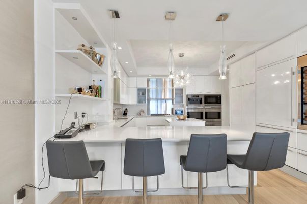 Chandelier, Interior, Kitchen, Pendant Lights, Recessed Lighting, Stainless Steel Appliances, Wood Texture Flooring