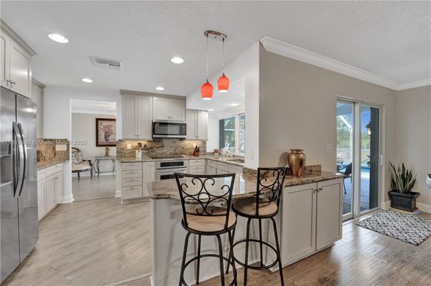 Interior, Kitchen, Pendant Lights, Recessed Lighting, Stainless Steel Appliances, Wood Texture Flooring