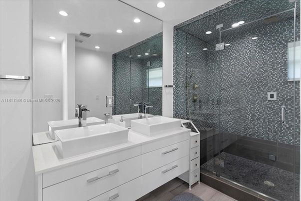 Bathroom, Dual Sink Vanities, Glass Shower, Interior, Recessed Lighting, Wood Texture Flooring