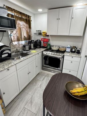 Interior, Kitchen, Marble, Recessed Lighting, Stainless Steel Appliances, Wood Texture Flooring