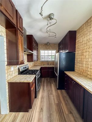 Interior, Kitchen, Tile Countertops, Wood Texture Flooring