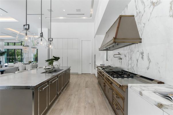 Interior, Kitchen, Marble Walls, Pendant Lights, Recessed Lighting, Stainless Steel Appliances, Wood Texture Flooring