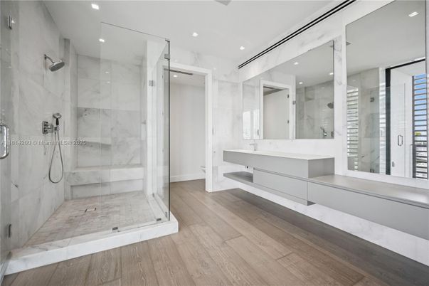 Bathroom, Glass Shower, Interior, Marble Walls, Recessed Lighting, Wood Texture Flooring