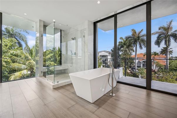 Bathroom, Free Standing Baths, Glass Shower, Interior, Marble Walls, Recessed Lighting, Wood Texture Flooring
