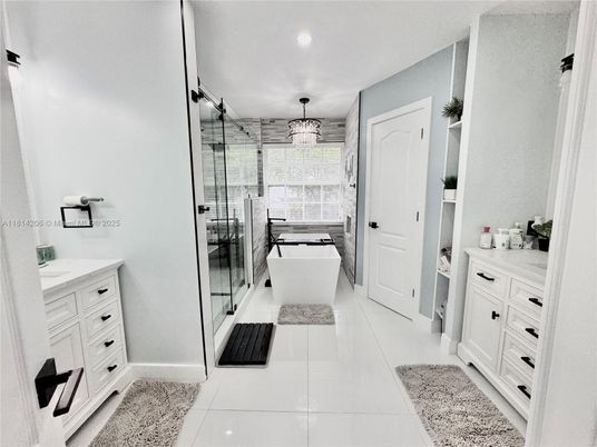 Bathroom, Chandelier, Free Standing Baths, Glass Shower, Interior, Recessed Lighting