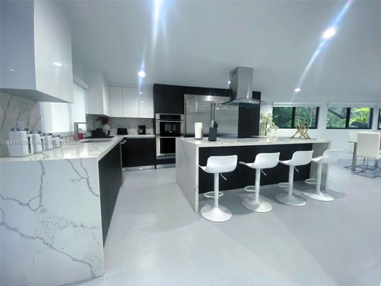 Interior, Kitchen, Marble Walls, Recessed Lighting, Stainless Steel Appliances