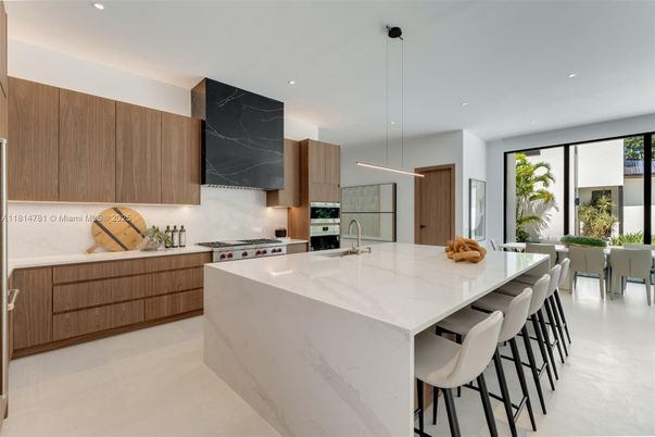 Interior, Kitchen, Marble Walls, Pendant Lights, Recessed Lighting, Stainless Steel Appliances