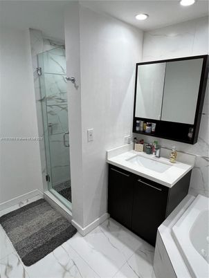 Bathroom, Dual Sink Vanities, Glass Shower, Interior, Marble, Marble Walls, Recessed Lighting