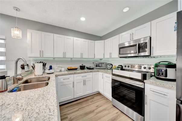 Interior, Kitchen, Pendant Lights, Recessed Lighting, Stainless Steel Appliances, Wood Texture Flooring