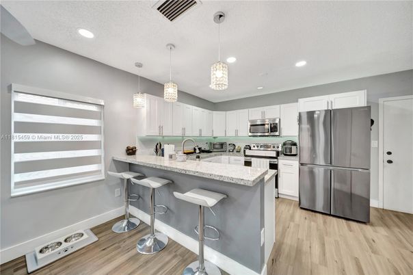 Interior, Kitchen, Pendant Lights, Recessed Lighting, Stainless Steel Appliances, Wood Texture Flooring