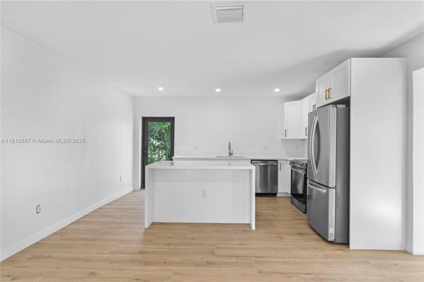 Interior, Kitchen, Recessed Lighting, Stainless Steel Appliances, Wood Texture Flooring