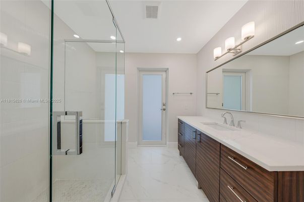Bathroom, Dual Sink Vanities, Glass Shower, Interior, Marble, Recessed Lighting