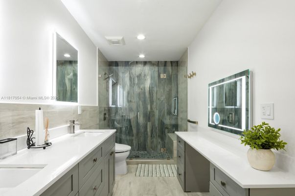 Bathroom, Dual Sink Vanities, Glass Shower, Interior, Recessed Lighting, Wood Texture Flooring