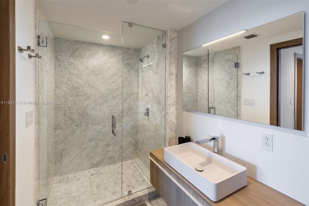 Bathroom, Glass Shower, Interior, Marble Walls, Recessed Lighting, Wood Texture Flooring