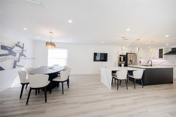 Chandelier, Dining room, Interior, Kitchen, Pendant Lights, Recessed Lighting, Stainless Steel Appliances, Wood Texture Flooring