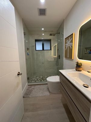 Bathroom, Dual Sink Vanities, Free Standing Baths, Glass Shower, Interior, Marble Walls, Recessed Lighting