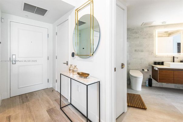 Bathroom, Dual Sink Vanities, Interior, Marble Walls, Wood Texture Flooring