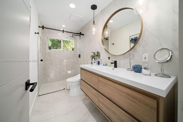 Bathroom, Dual Sink Vanities, Glass Shower, Interior, Marble, Pendant Lights, Recessed Lighting