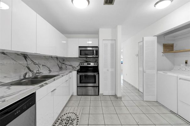 Interior, Kitchen, Marble Walls, Stainless Steel Appliances, Utility Closets, Washer