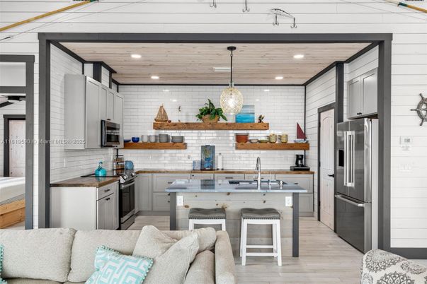 Interior, Kitchen, Pendant Lights, Recessed Lighting, Stainless Steel Appliances, Stone Walls, Wooden Ceilings, Wood Texture Flooring