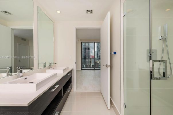 Bathroom, Dual Sink Vanities, Glass Shower, Interior, Recessed Lighting, Wood Texture Flooring