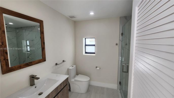 Bathroom, Glass Shower, Interior, Marble Walls, Recessed Lighting, Wood Texture Flooring