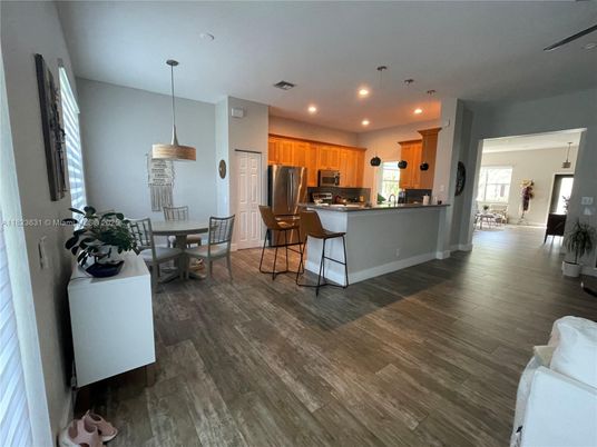 Dining room, Interior, Kitchen, Pendant Lights, Recessed Lighting, Stainless Steel Appliances, Wood Texture Flooring