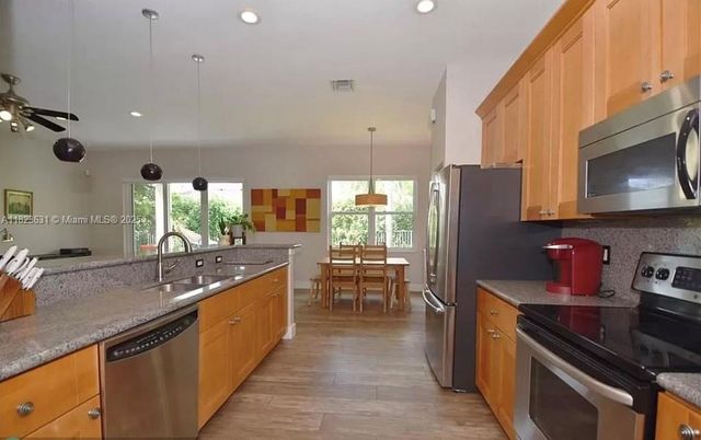 Dining room, Interior, Kitchen, Pendant Lights, Recessed Lighting, Stainless Steel Appliances, Wood Texture Flooring