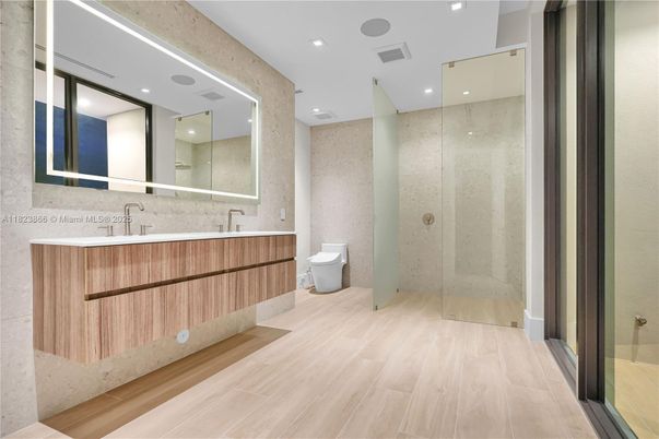 Bathroom, Dual Sink Vanities, Glass Shower, Interior, Recessed Lighting, Wood Texture Flooring