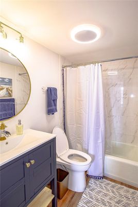 Bathroom, Glass Shower, Interior, Marble Walls, Recessed Lighting, Wood Texture Flooring