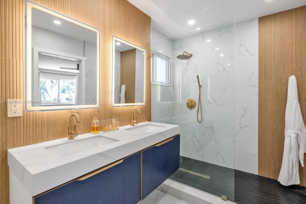 Bathroom, Dual Sink Vanities, Glass Shower, Interior, Marble, Marble Walls, Recessed Lighting
