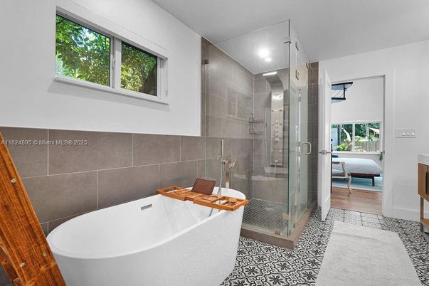 Bathroom, Free Standing Baths, Glass Shower, Interior, Recessed Lighting, Wood Texture Flooring