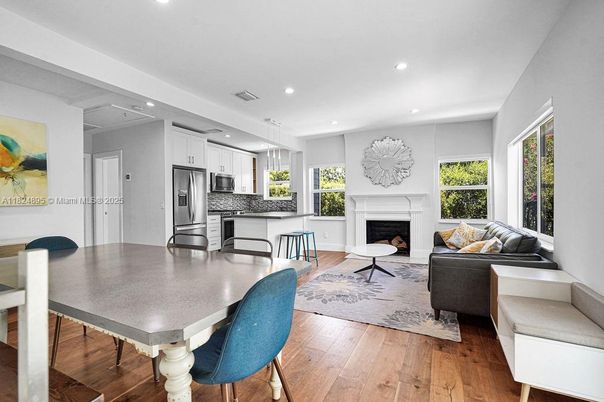Dining room, Fireplace, Interior, Kitchen, Living room, Pendant Lights, Recessed Lighting, Stainless Steel Appliances, Wood Texture Flooring