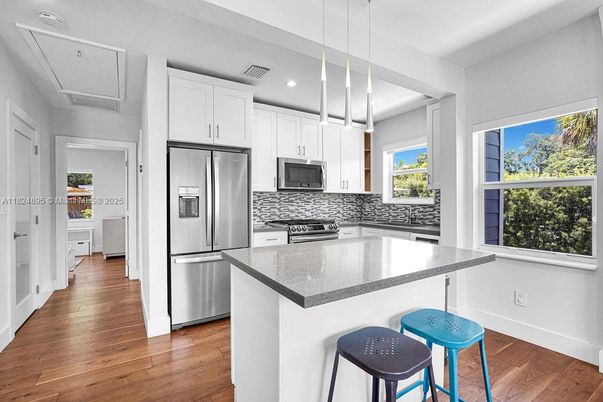 Interior, Kitchen, Pendant Lights, Recessed Lighting, Stainless Steel Appliances, Wood Texture Flooring