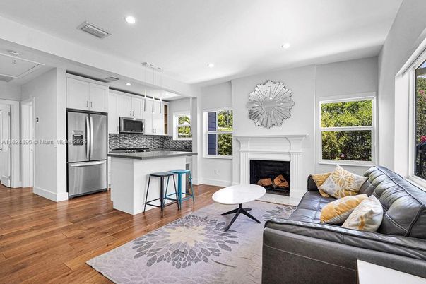 Fireplace, Interior, Kitchen, Living room, Pendant Lights, Recessed Lighting, Stainless Steel Appliances, Wood Texture Flooring