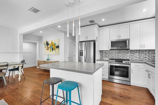 Interior, Kitchen, Pendant Lights, Recessed Lighting, Stainless Steel Appliances, Wood Texture Flooring