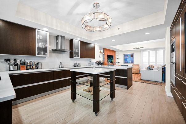 Chandelier, Interior, Kitchen, Living room, Pendant Lights, Recessed Lighting, Stainless Steel Appliances, Wood Texture Flooring