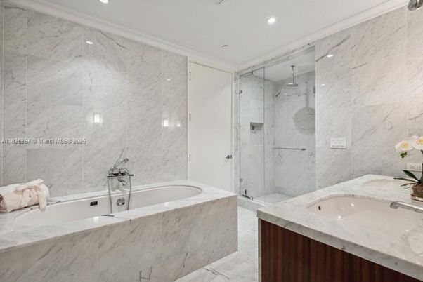 Bathroom, Dual Sink Vanities, Glass Shower, Interior, Marble, Marble Walls, Recessed Lighting