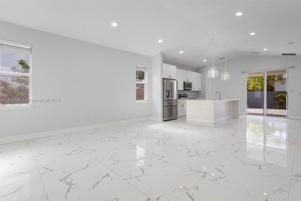 Empty room, Interior, Kitchen, Marble, Pendant Lights, Recessed Lighting, Stainless Steel Appliances