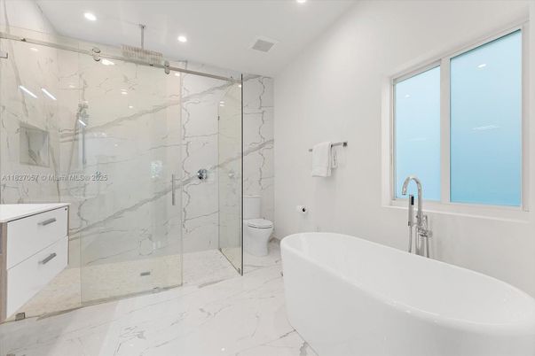 Bathroom, Free Standing Baths, Glass Shower, Interior, Marble, Marble Walls, Recessed Lighting