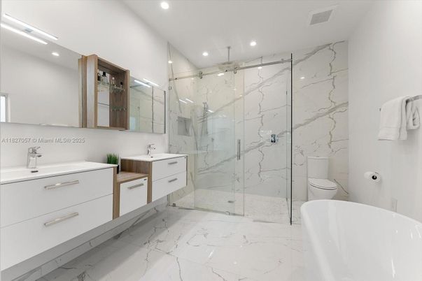 Bathroom, Dual Sink Vanities, Free Standing Baths, Glass Shower, Interior, Marble, Marble Walls, Recessed Lighting