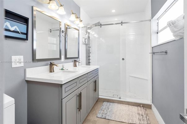 Bathroom, Dual Sink Vanities, Glass Shower, Interior, Recessed Lighting, Wood Texture Flooring