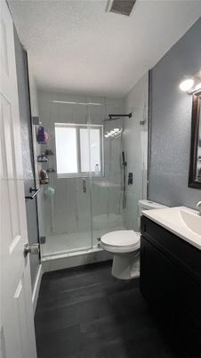 Bathroom, Glass Shower, Interior, Marble Walls, Wood Texture Flooring