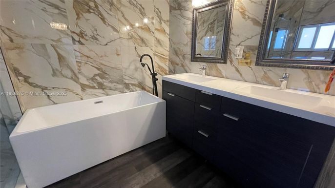 Bathroom, Dual Sink Vanities, Free Standing Baths, Interior, Marble Walls, Wood Texture Flooring