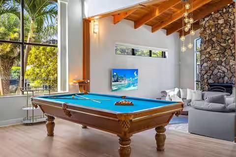 Billiard Table, Fireplace, Game Room, Interior, Pendant Lights, Stone Walls, Wooden Beams, Wooden Ceilings, Wood Texture Flooring