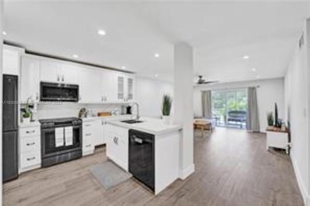 Dining room, Interior, Kitchen, Recessed Lighting, Stainless Steel Appliances, Wood Texture Flooring
