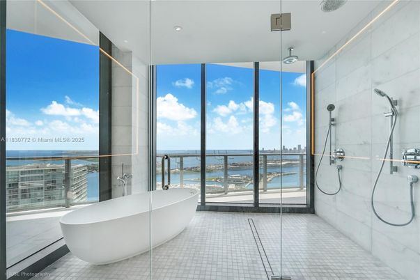 Bathroom, Free Standing Baths, Glass Shower, Interior, Marble Walls, Recessed Lighting, Water