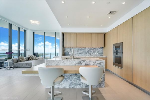 Interior, Kitchen, Living room, Marble Walls, Recessed Lighting, Stainless Steel Appliances, Water, Wood Texture Flooring