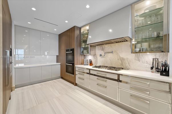 Interior, Kitchen, Marble Walls, Recessed Lighting, Stainless Steel Appliances